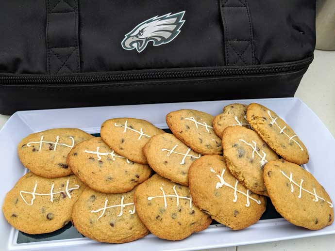 Philadelphia Eagles Football Cookies on a Platter Next to Black Logo Bag