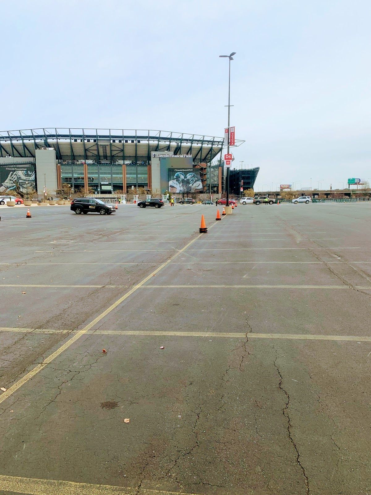 Use cones to block off parking spots for Philadelphia Eagles tailgating.